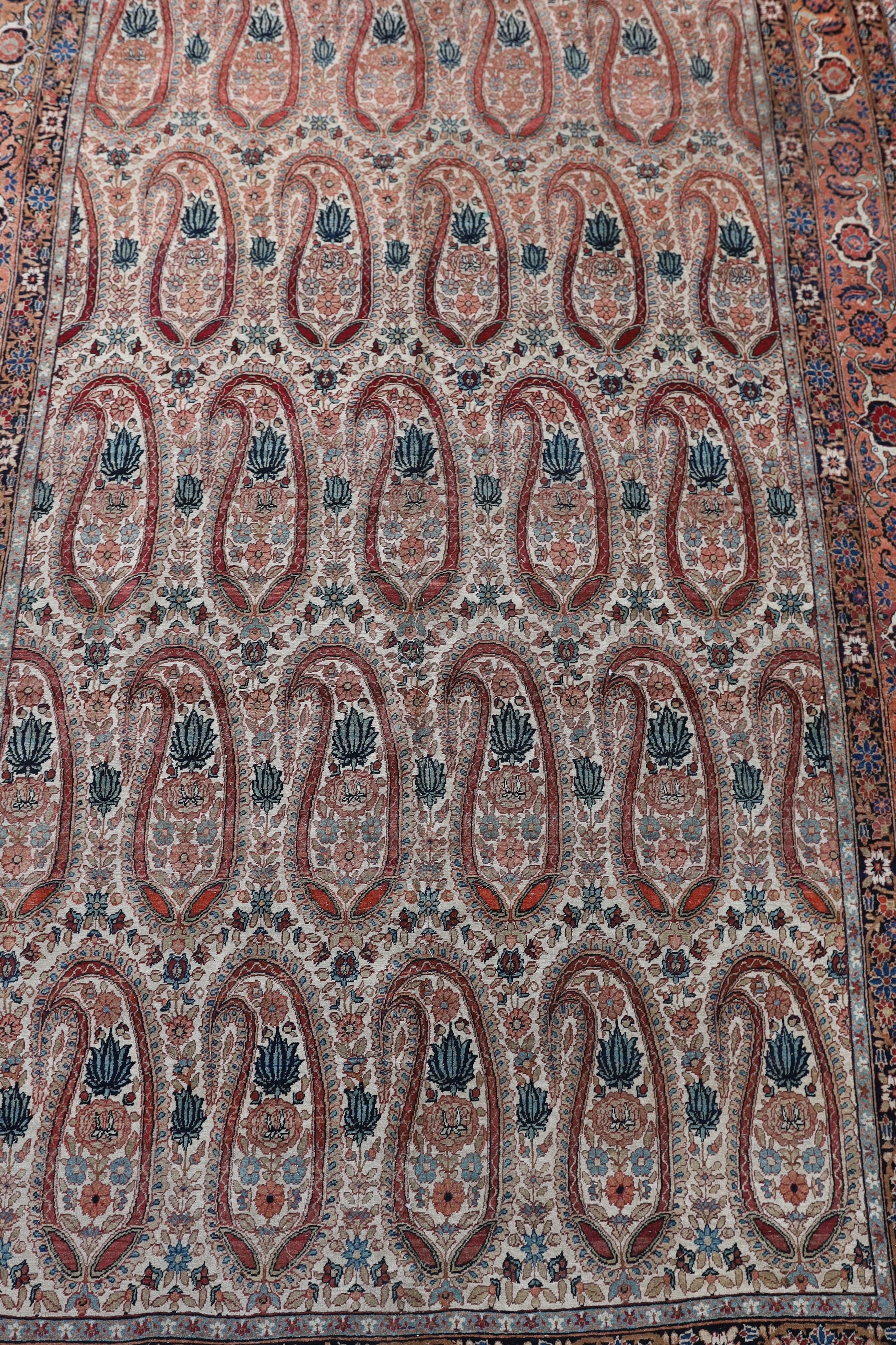A Kerman rug ivory ground carpet, 360 x 218cm.